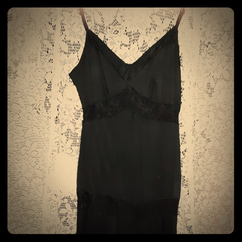 Black dress with see through midriff.